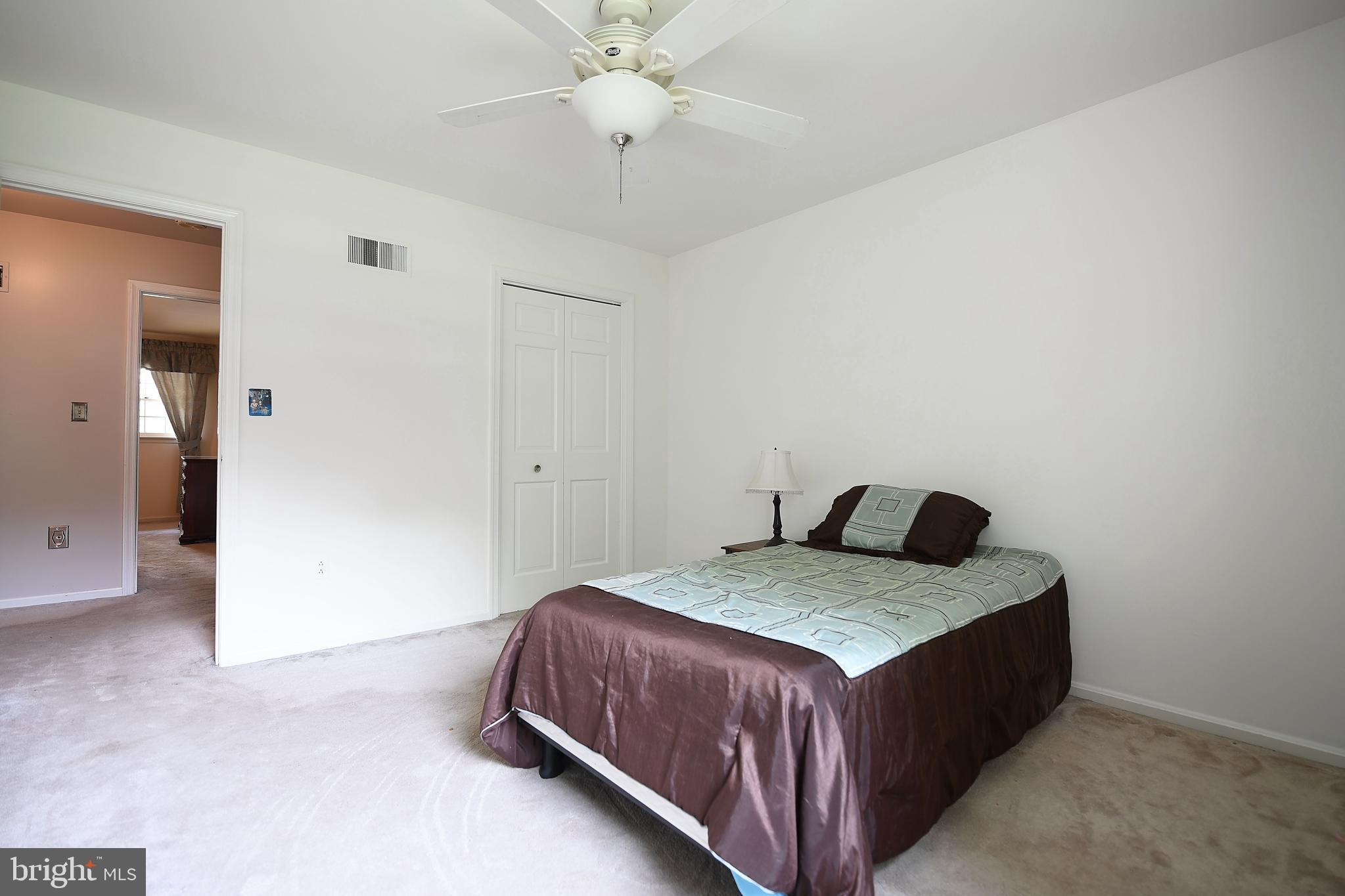 1303 Old Fallston Road Fallston, MD 21047 - Photo 35 of 65 a bedroom with a bed and a chandelier