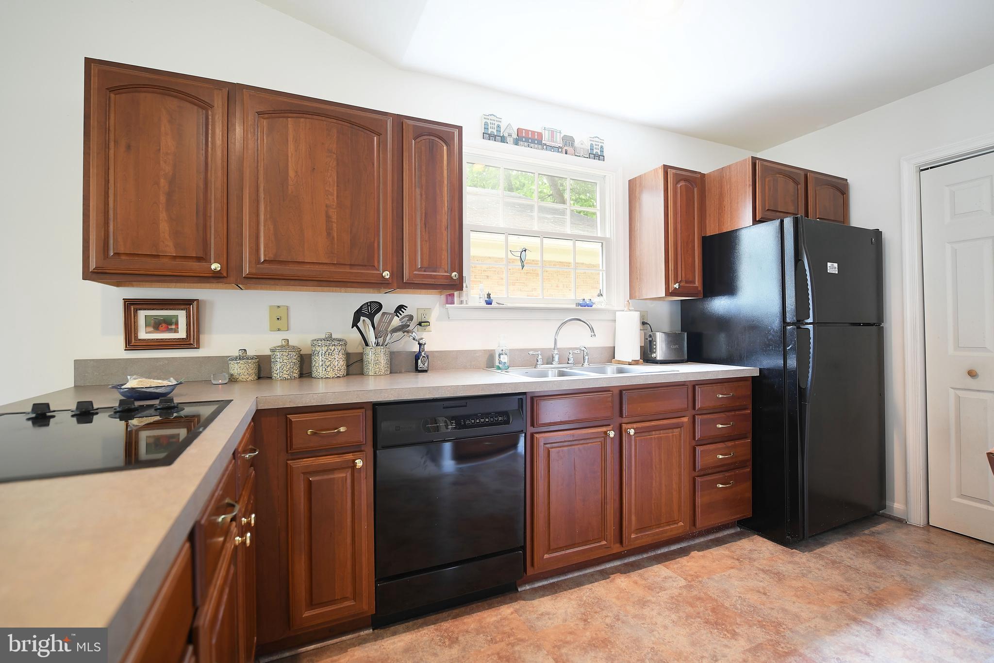 1303 Old Fallston Road Fallston, MD 21047 - Photo 49 of 65 a kitchen with stainless steel appliances granite countertop a refrigerator stove and sink