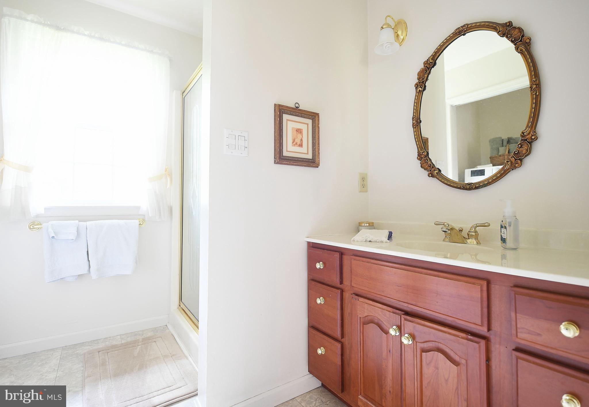 1303 Old Fallston Road Fallston, MD 21047 - Photo 53 of 65 a bathroom with a sink and a mirror