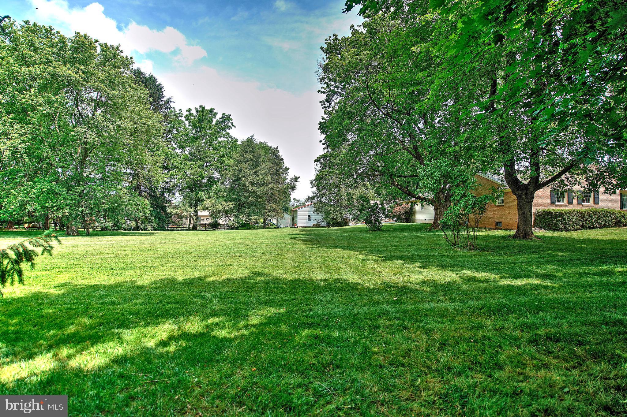 1303 Old Fallston Road Fallston, MD 21047 - Photo 57 of 65 a view of green field with trees in the background
