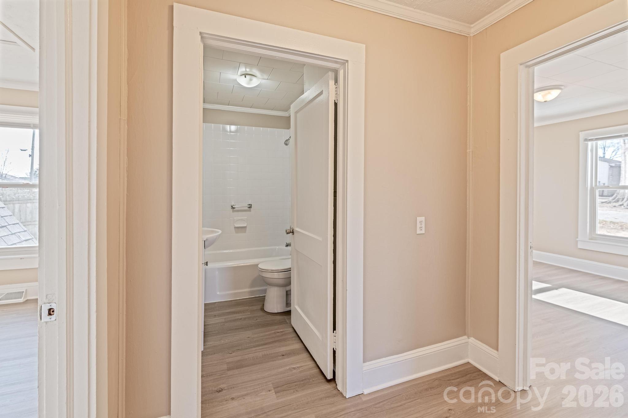 569 Hunter Avenue Kannapolis, NC 28083 - Photo 12 of 20 a bathroom view of a toilet and a mirror