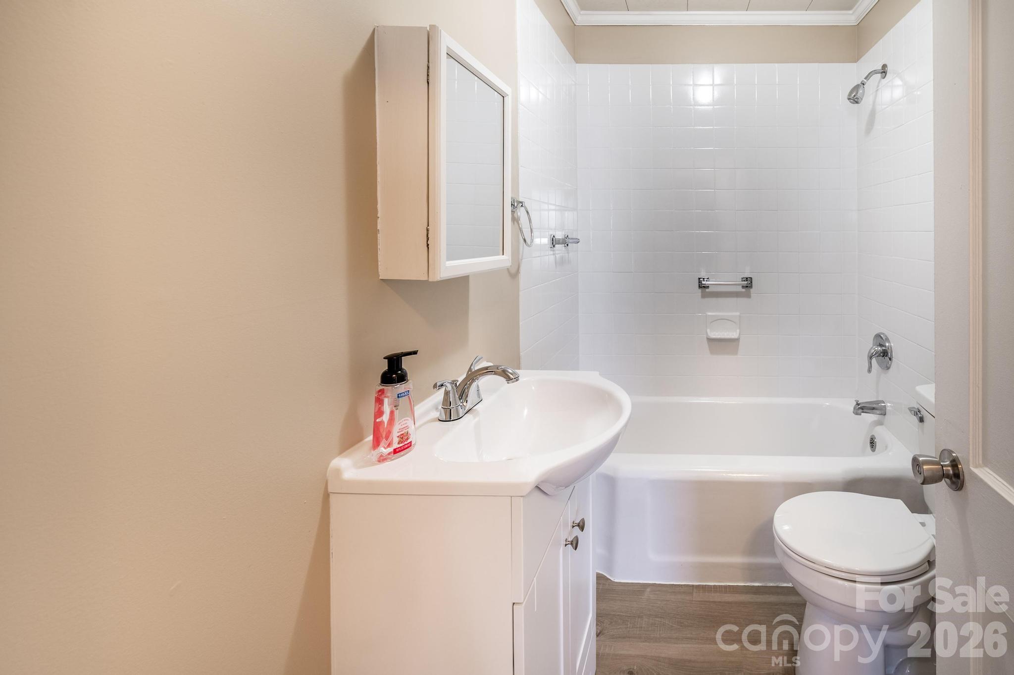 569 Hunter Avenue Kannapolis, NC 28083 - Photo 13 of 20 a bathroom with a sink toilet and shower