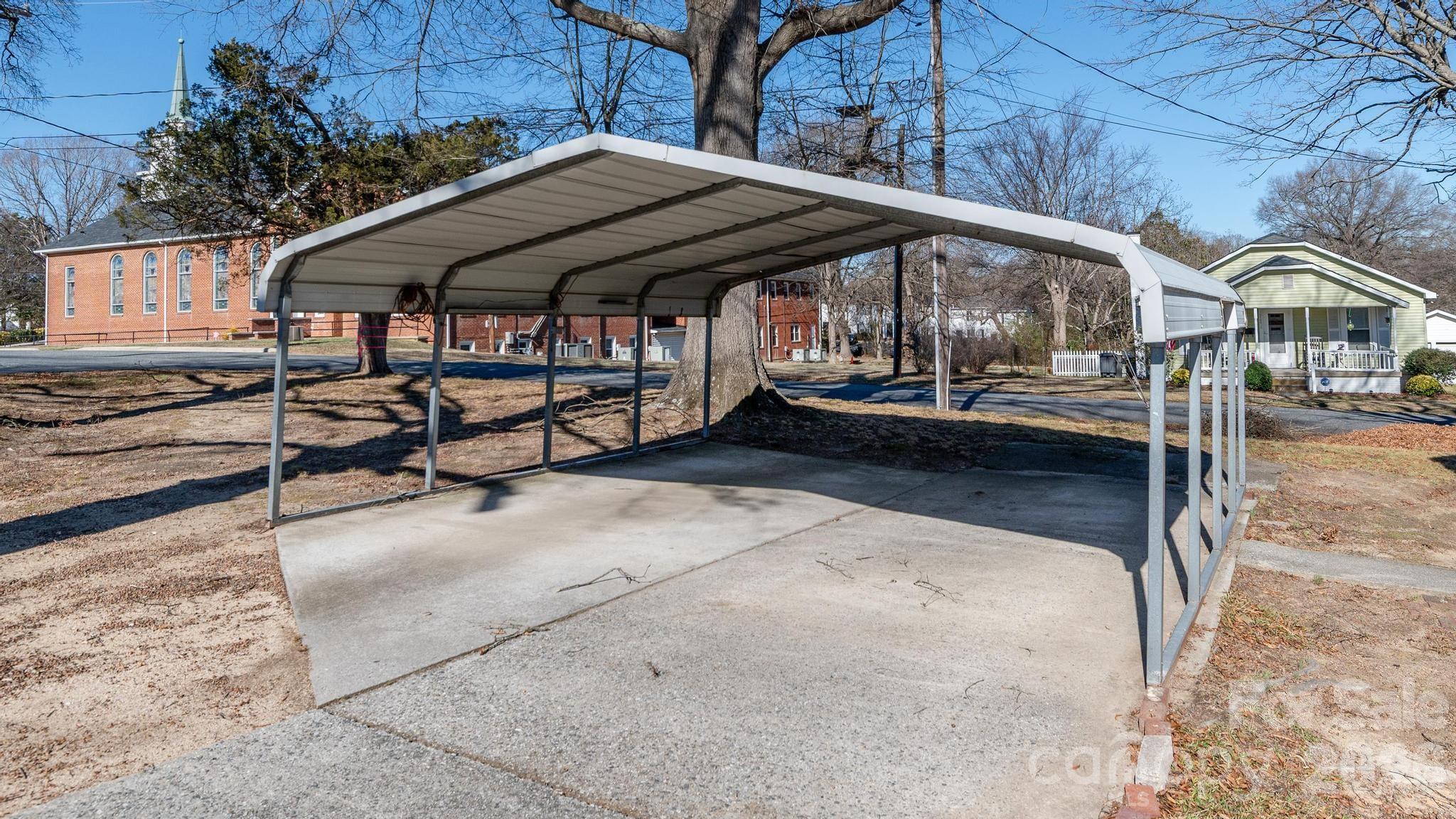 569 Hunter Avenue Kannapolis, NC 28083 - Photo 17 of 20 a view of patio with chairs and umbrellas