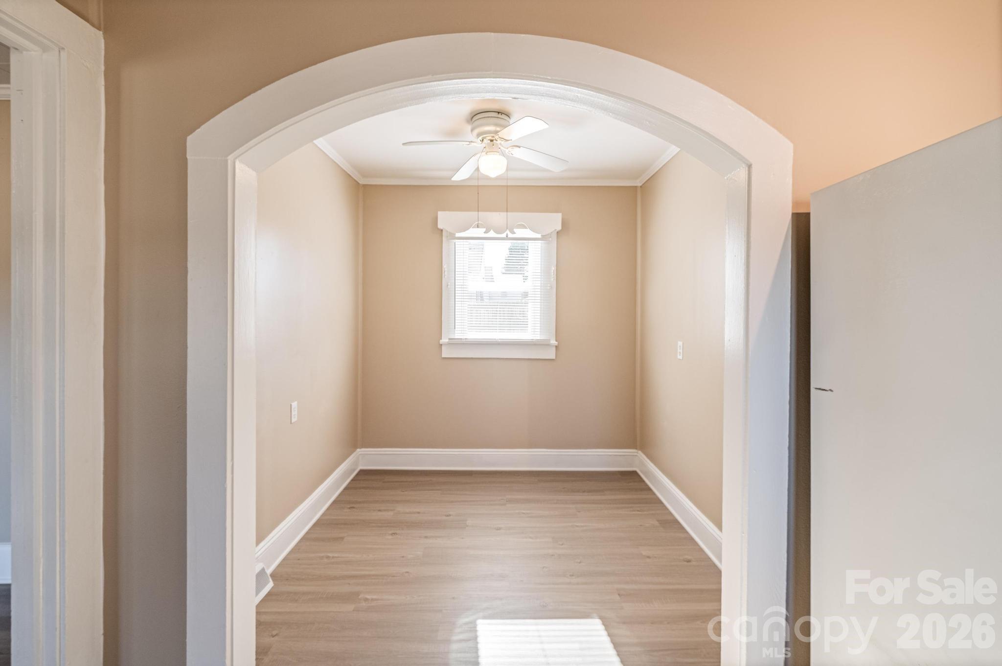 569 Hunter Avenue Kannapolis, NC 28083 - Photo 10 of 20 an empty room with wooden floor and windows