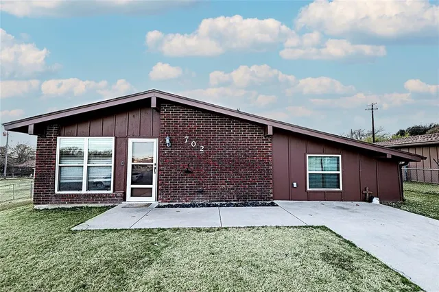 front view of a house with a yard