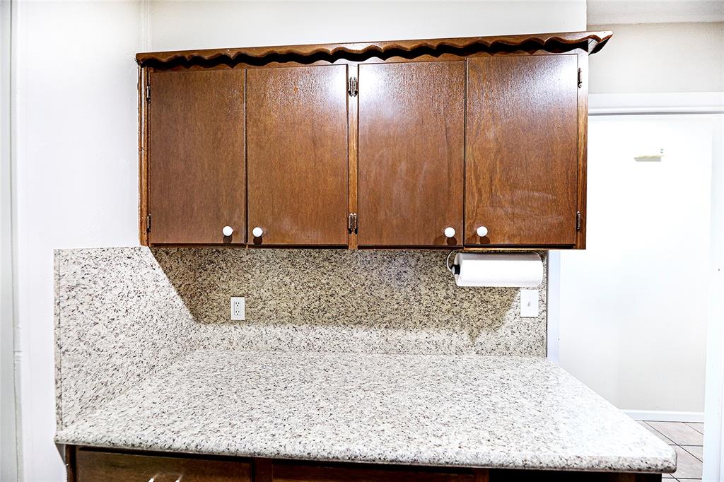 702 Decatur Street Bowie, TX 76230 - Photo 16 of 36 a view of a refrigerator in a kitchen