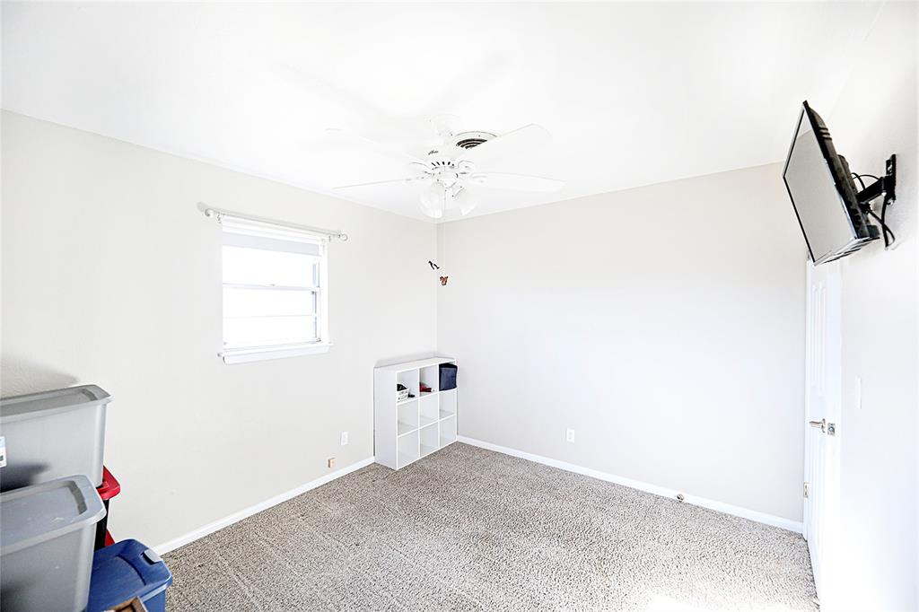 702 Decatur Street Bowie, TX 76230 - Photo 22 of 36 a view of empty room with wooden floor