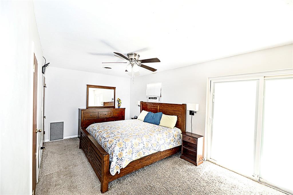 702 Decatur Street Bowie, TX 76230 - Photo 26 of 36 a bedroom with a bed and window