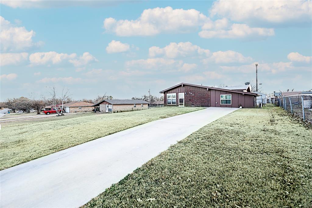 702 Decatur Street Bowie, TX 76230 - Photo 3 of 36 a view of an outdoor space and seating area