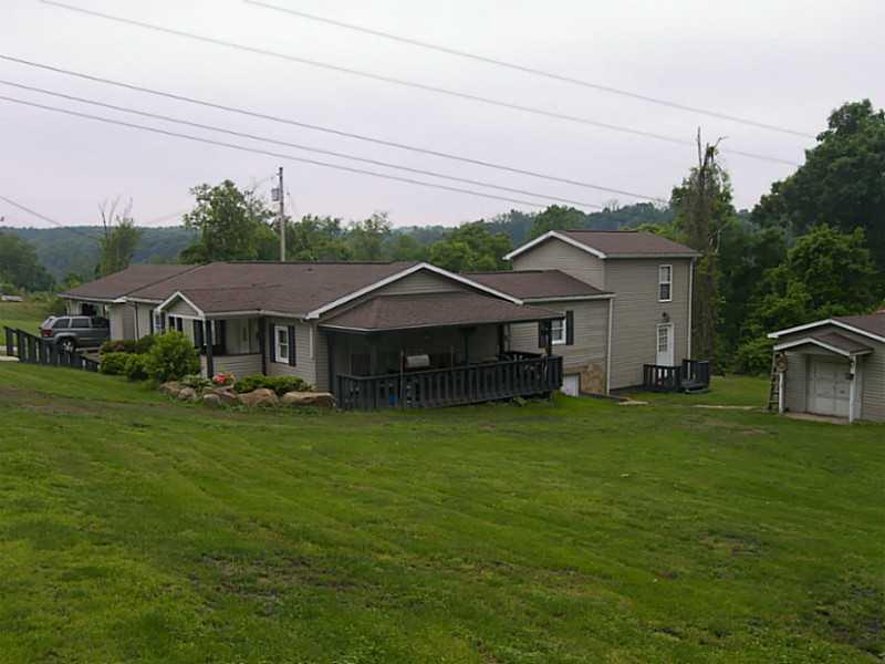 106 Santa Barbara Road Smithton, PA 15479 - Photo 2 of 19 Exterior Front. Large yard