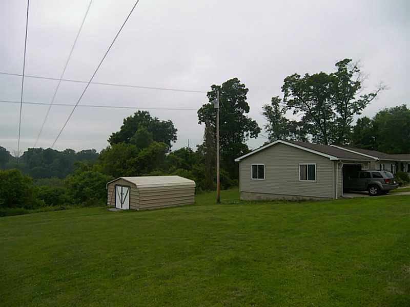 106 Santa Barbara Road Smithton, PA 15479 - Photo 19 of 19 Exterior Front. Two car garage and out building
