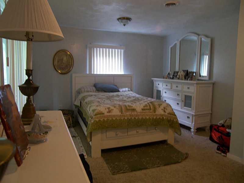 106 Santa Barbara Road Smithton, PA 15479 - Photo 9 of 19 Master Bedroom. Master bedroom with large closet and sliding glass doors leading out to side deck