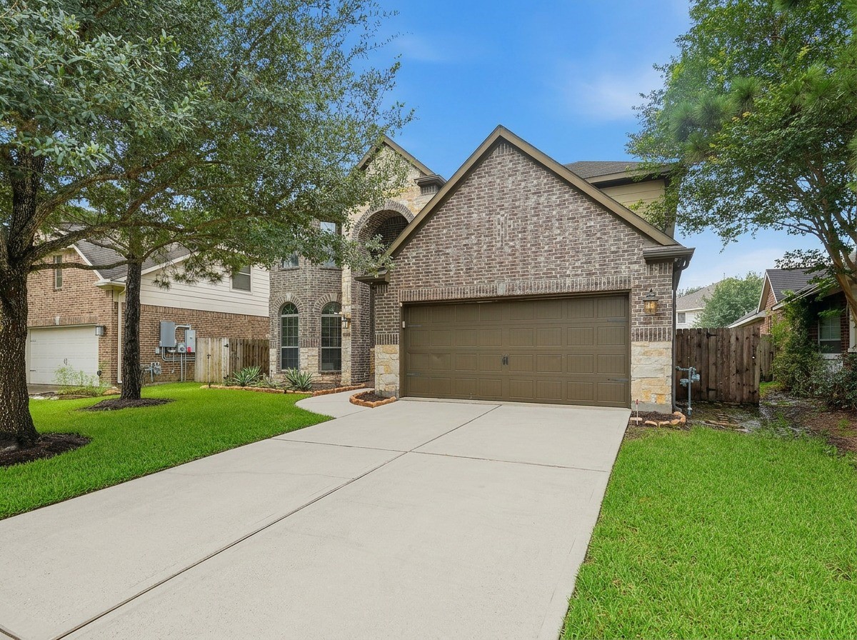 12410 Adams Ridge Lane Humble, TX 77346 - Photo 5 of 33 Traditional brick with a modern stone accent.