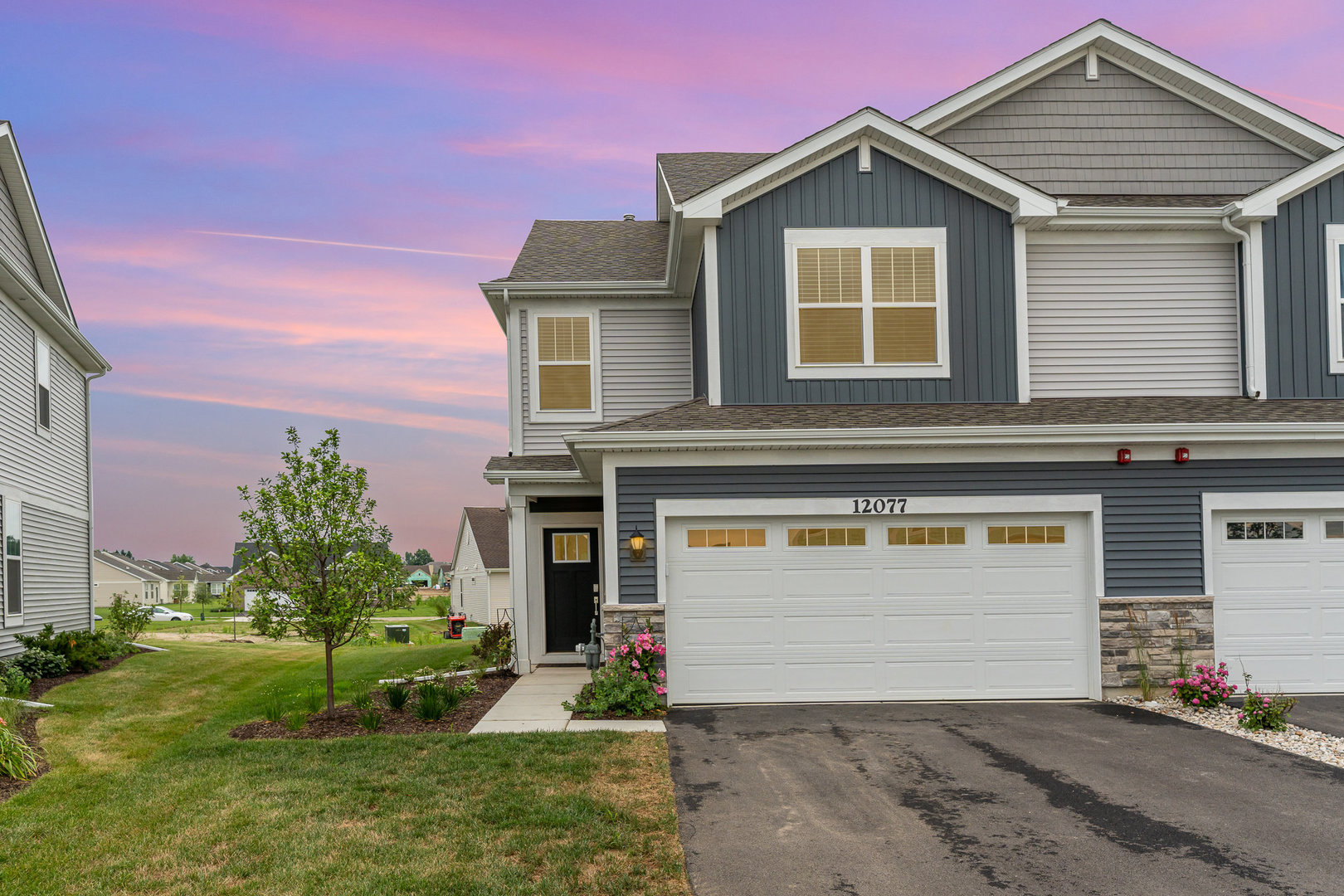 12077 Jordi Road Huntley, IL 60142 - Photo 1 of 1 a front view of a house with a yard and garage