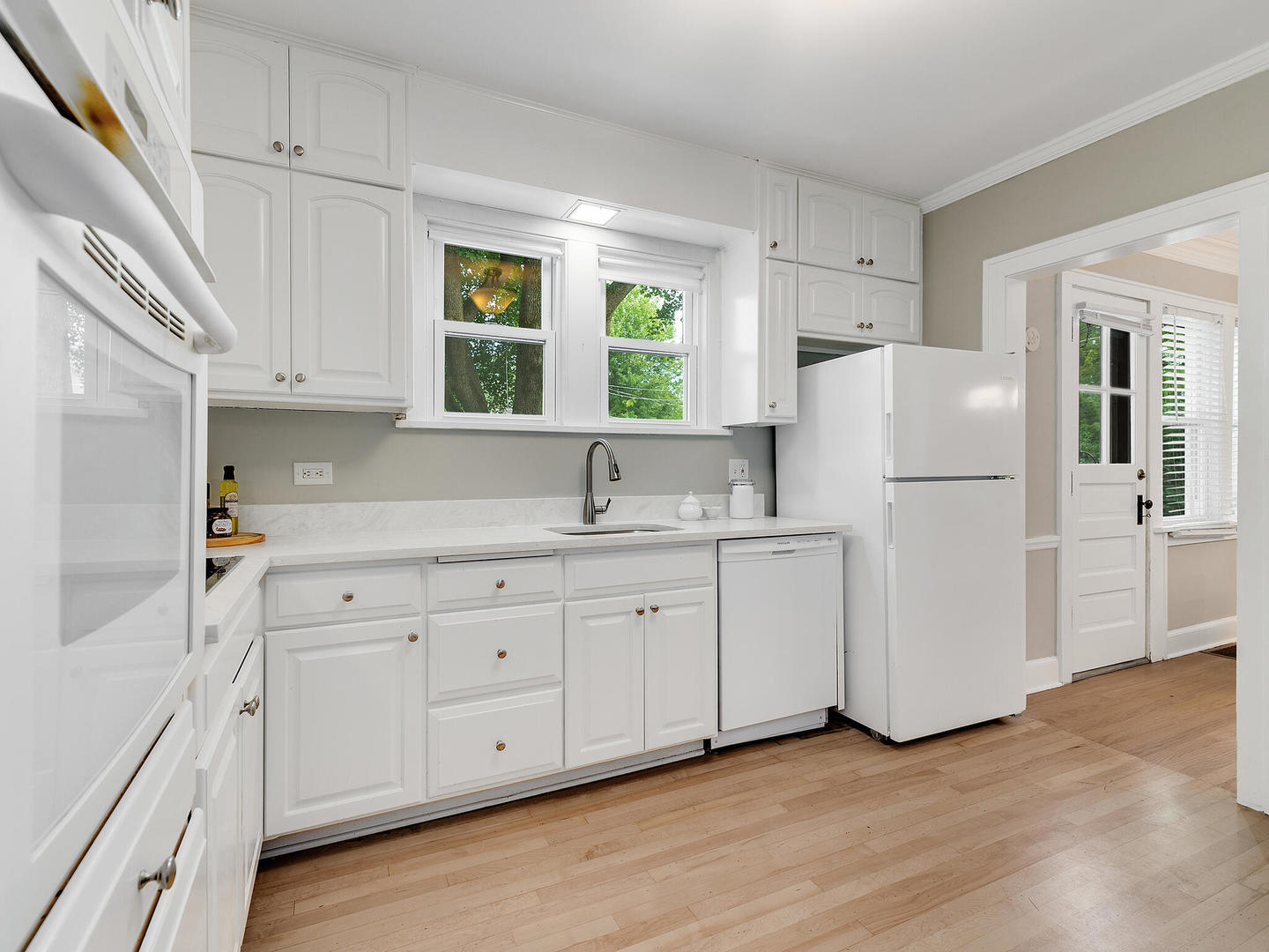 161 E Road Glen Ellyn, IL 60137 - Photo 16 of 27 a kitchen with white cabinets and white appliances
