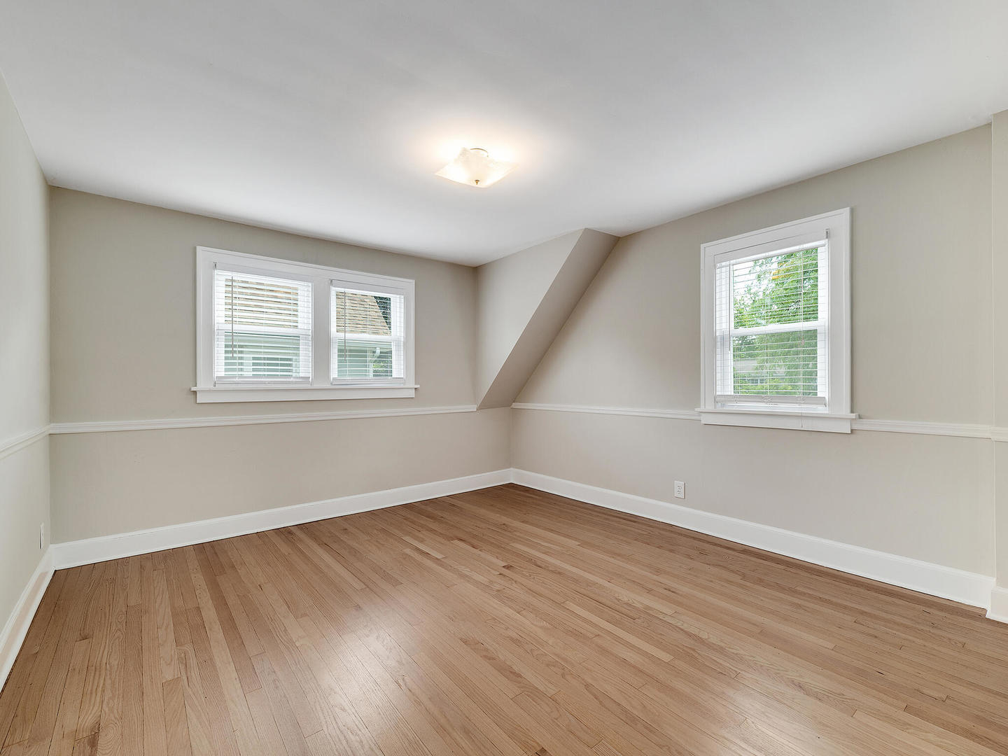 161 E Road Glen Ellyn, IL 60137 - Photo 21 of 27 a view of an empty room with wooden floor and a window