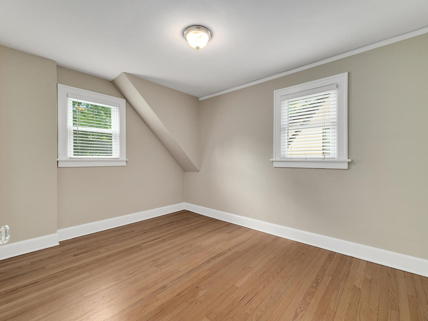 161 E Road Glen Ellyn, IL 60137 - Photo 22 of 27 an empty room with wooden floor and windows