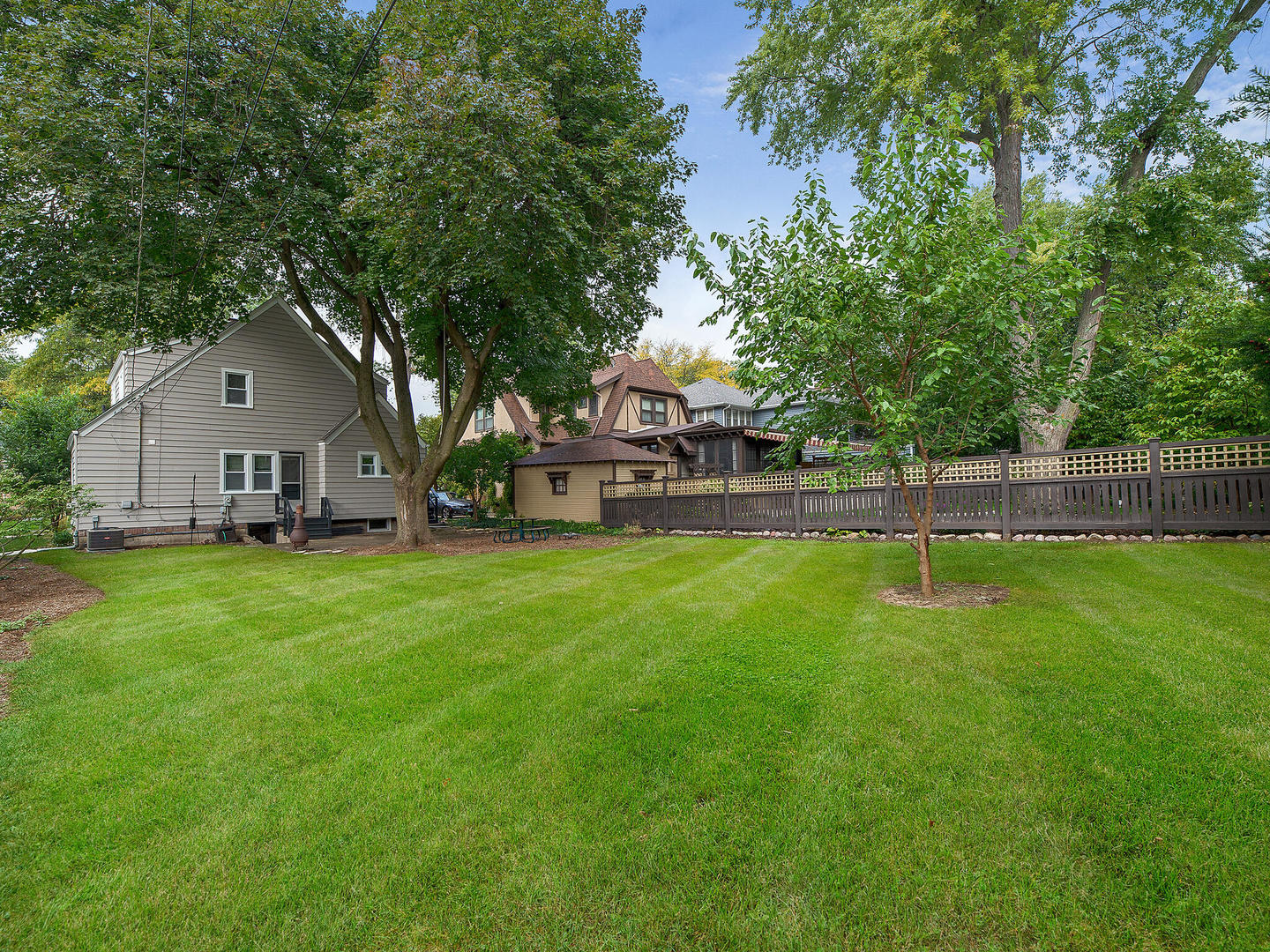 161 E Road Glen Ellyn, IL 60137 - Photo 27 of 27 a view of a house with a big yard and large trees