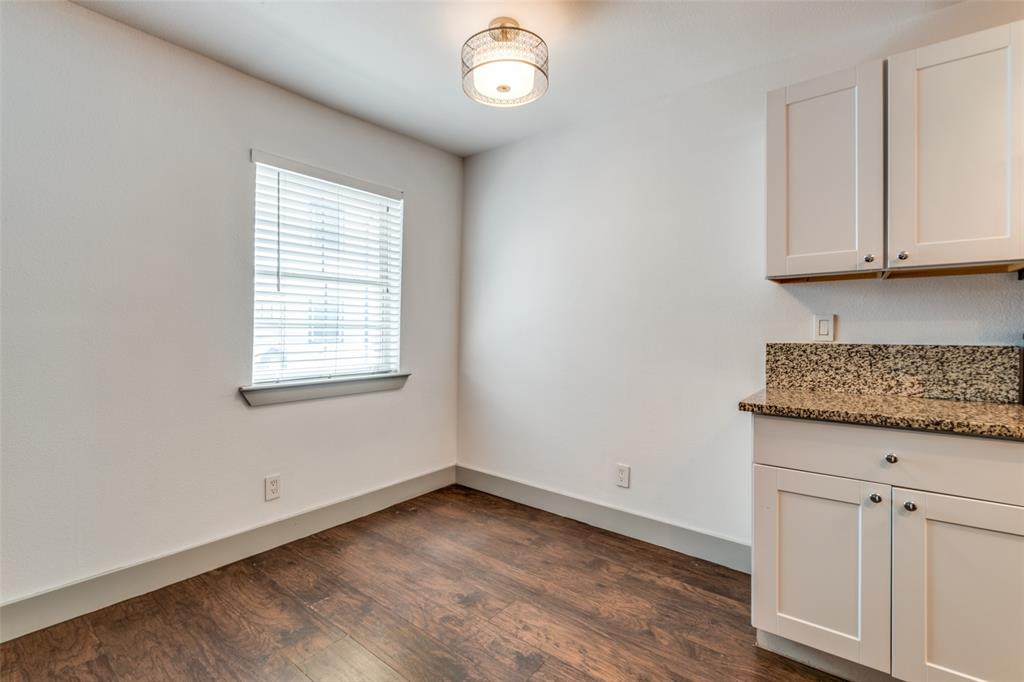 4633 Fairmount Street, Unit 109 Dallas, TX 75219 - Photo 6 of 14 Windowed space featuring wood-finish flooring, white walls, and a contemporary ceiling light fixture