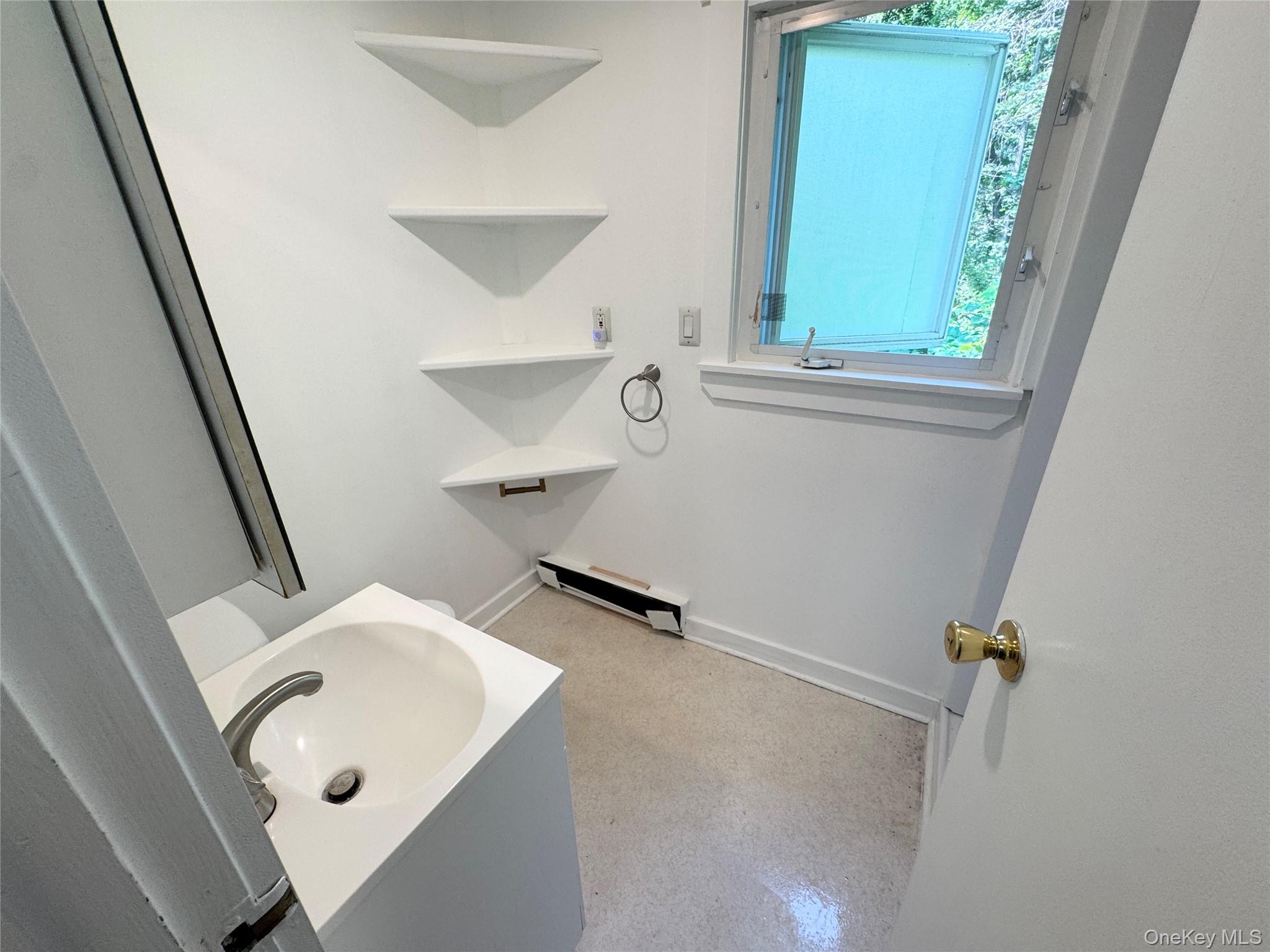 21 Derussey Lane Cornwall, NY 12518 - Photo 5 of 9 a bathroom with a sink and a mirror