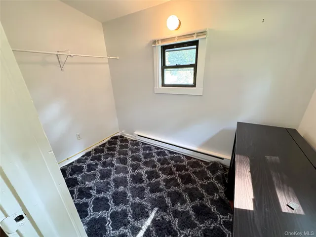 a bathroom with a black and white checkered floor