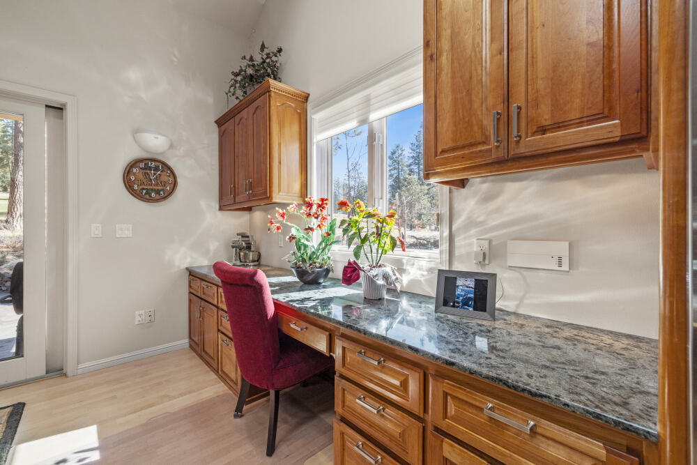 11629 Merganser Road Klamath Falls, OR 97601 - Photo 16 of 50 a kitchen with granite countertop cabinets and wooden floor
