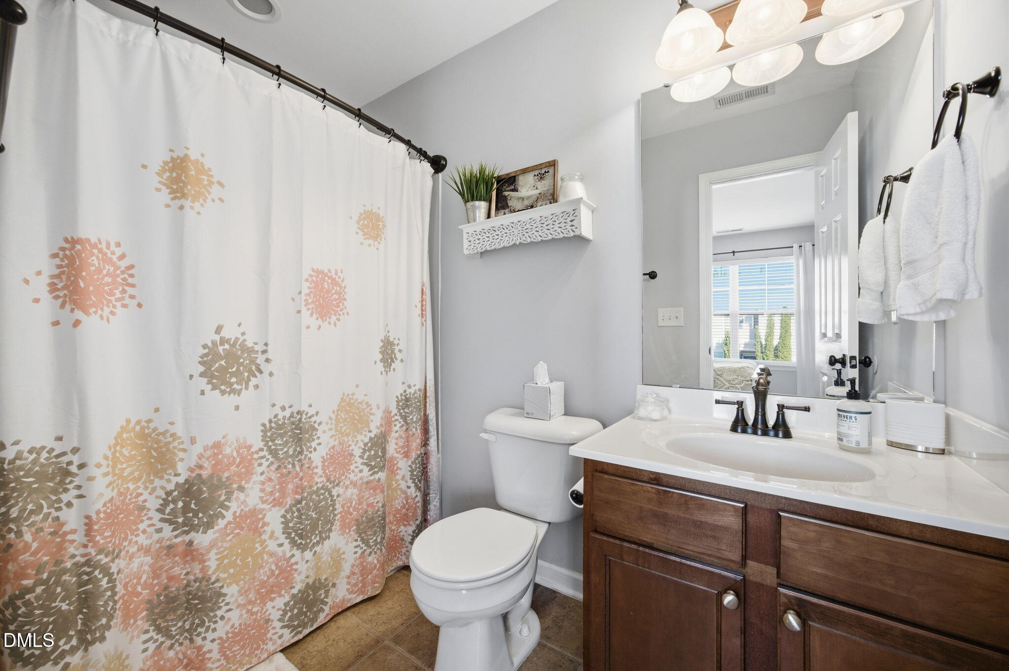 2827 Corbett Grove Drive Raleigh, NC 27616 - Photo 27 of 49 a bathroom with a sink toilet and shower