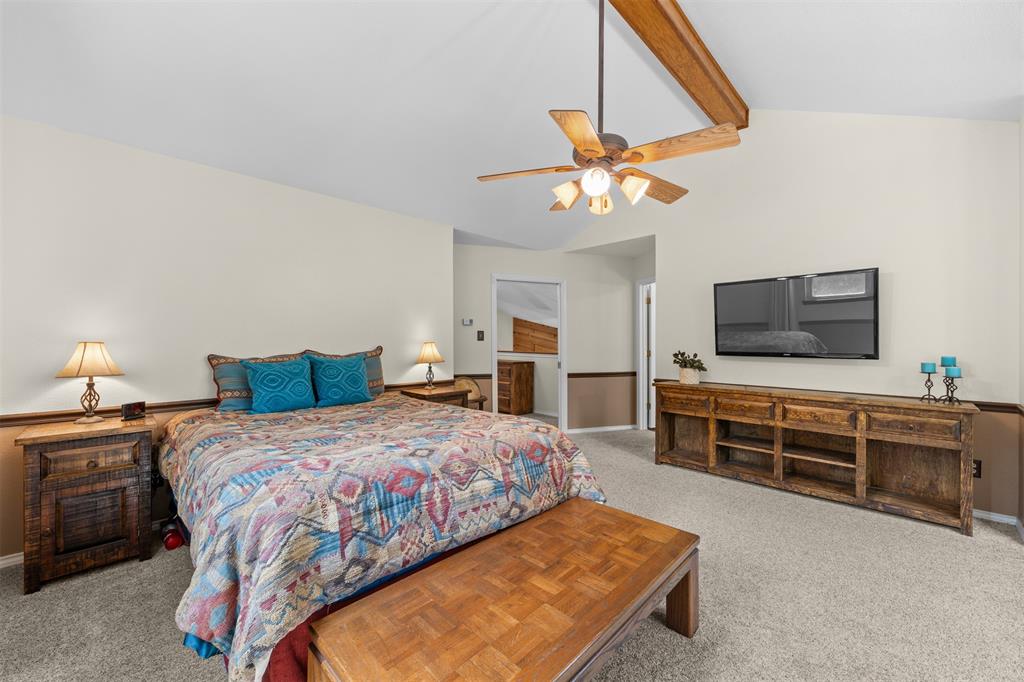 881 Wild Road Van Alstyne, TX 75495 - Photo 24 of 40 a bedroom with a bed and a flat screen tv