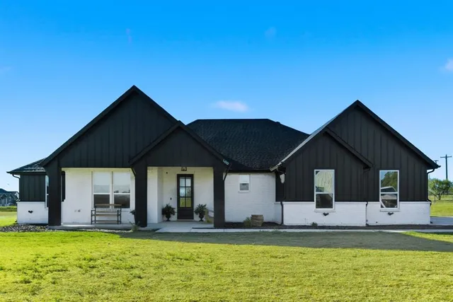 a front view of a house with swimming pool