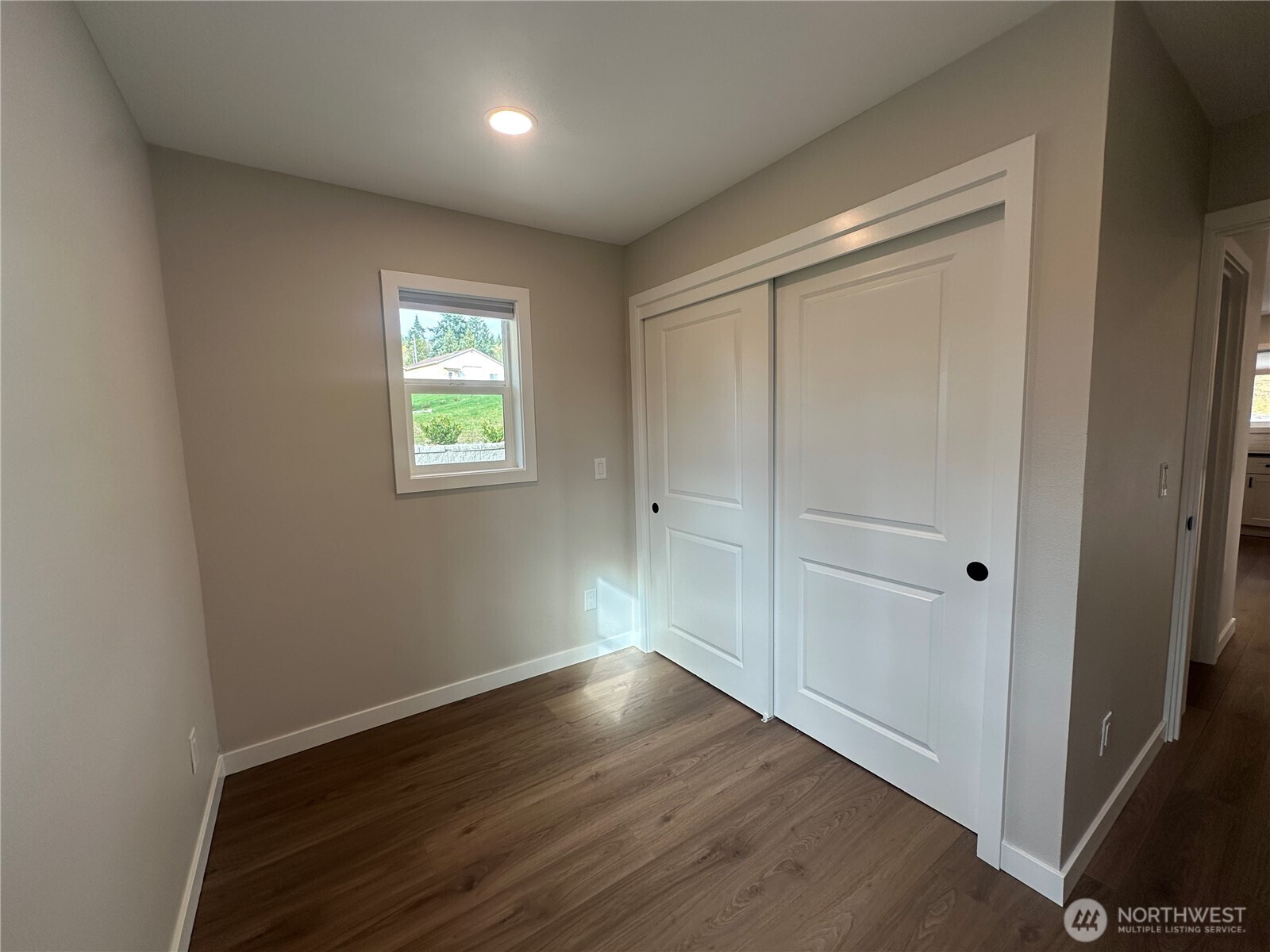 125 Foxglove Terrace Longview, WA 98632 - Photo 11 of 20 an empty room with wooden floor and windows