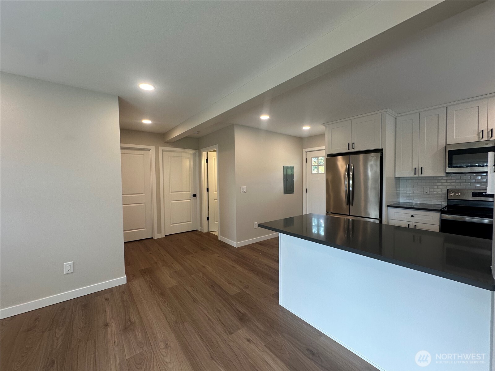 125 Foxglove Terrace Longview, WA 98632 - Photo 2 of 20 a large kitchen with stainless steel appliances a large counter top a stove and a refrigerator