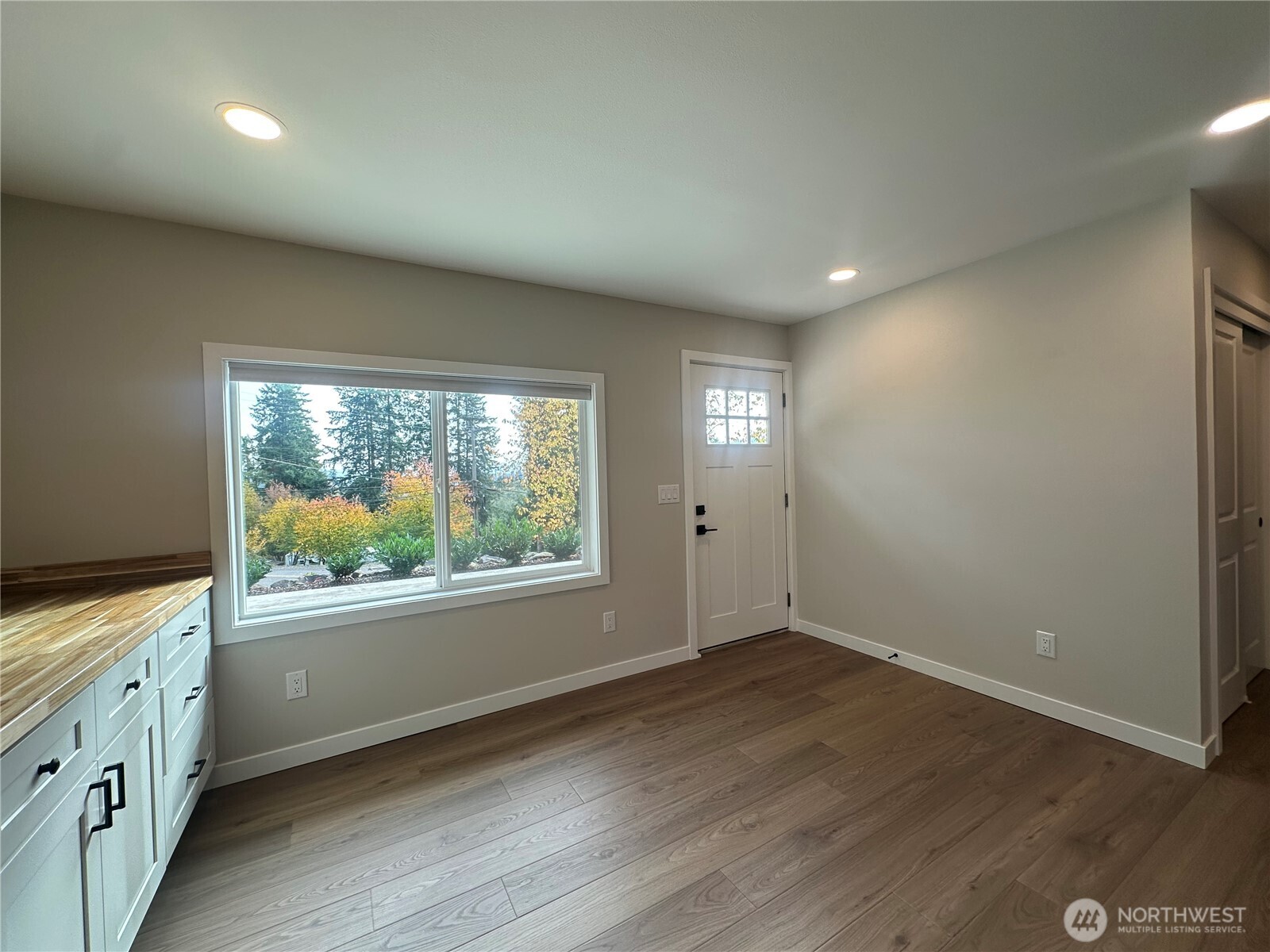 125 Foxglove Terrace Longview, WA 98632 - Photo 6 of 20 an empty room with wooden floor and windows