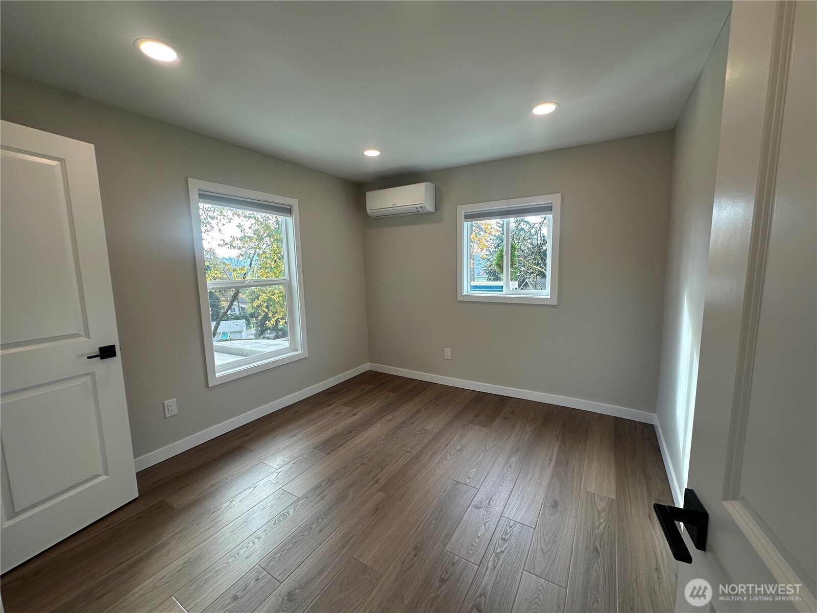 125 Foxglove Terrace Longview, WA 98632 - Photo 8 of 20 an empty room with wooden floor and windows