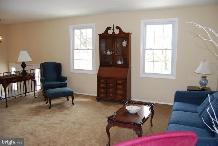 17317 Fletchall Road Poolesville, MD 20837 - Photo 2 of 18 a living room with furniture and a window