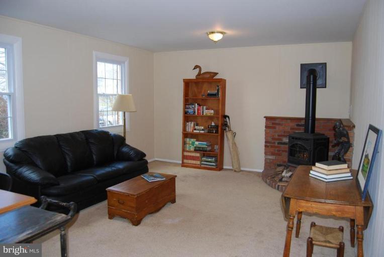 17317 Fletchall Road Poolesville, MD 20837 - Photo 10 of 18 a living room with furniture and a window