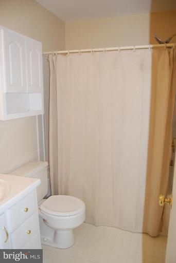 17317 Fletchall Road Poolesville, MD 20837 - Photo 11 of 18 a bathroom with a shower a toilet and a window
