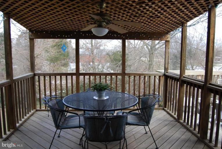 17317 Fletchall Road Poolesville, MD 20837 - Photo 12 of 18 a view of a balcony with table and chairs