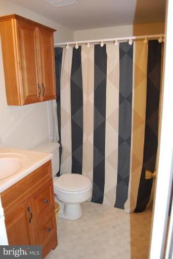 17317 Fletchall Road Poolesville, MD 20837 - Photo 15 of 18 a bathroom with a toilet and shower