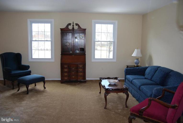 17317 Fletchall Road Poolesville, MD 20837 - Photo 3 of 18 a living room with furniture and a window