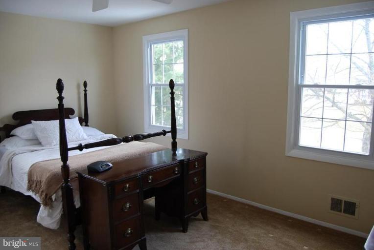 17317 Fletchall Road Poolesville, MD 20837 - Photo 7 of 18 a bedroom with a bed and window