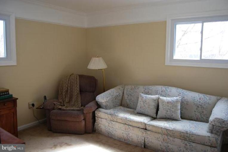 17317 Fletchall Road Poolesville, MD 20837 - Photo 9 of 18 a living room with furniture and a window