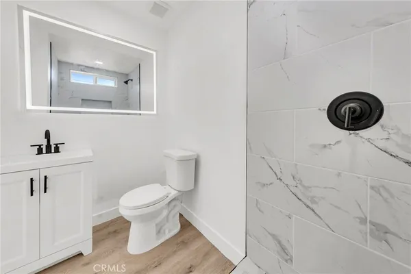 a bathroom with a toilet and a sink