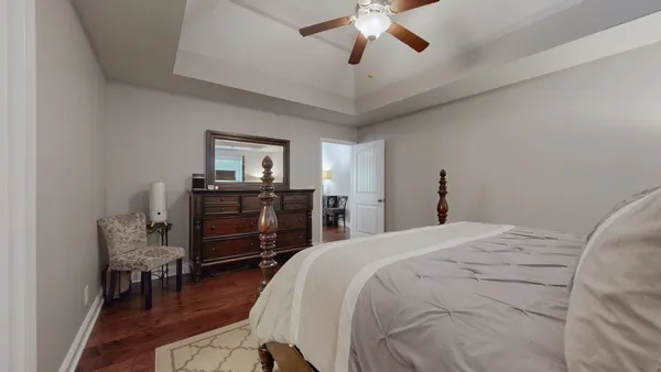 a bed room with a bed and a television