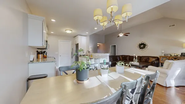 a kitchen with a table and chairs in it