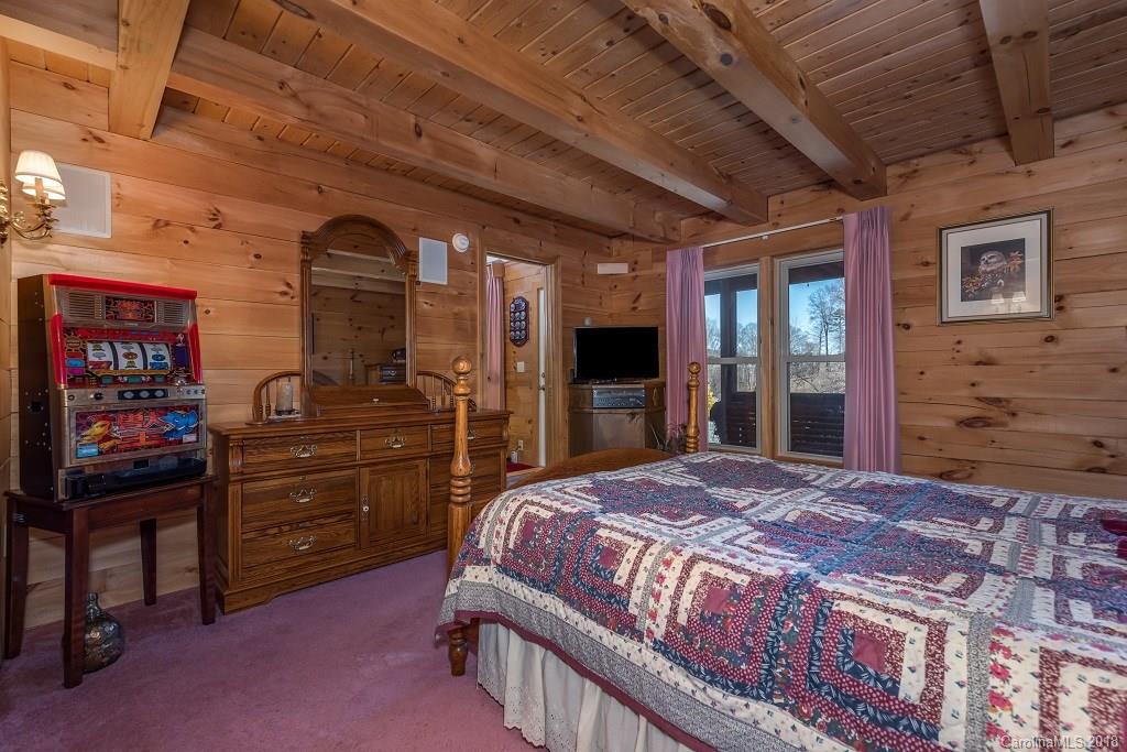 2141 Coxe Road, Unit 96 Rutherfordton, NC 28139 - Photo 11 of 25 a bedroom with a bed and a dresser