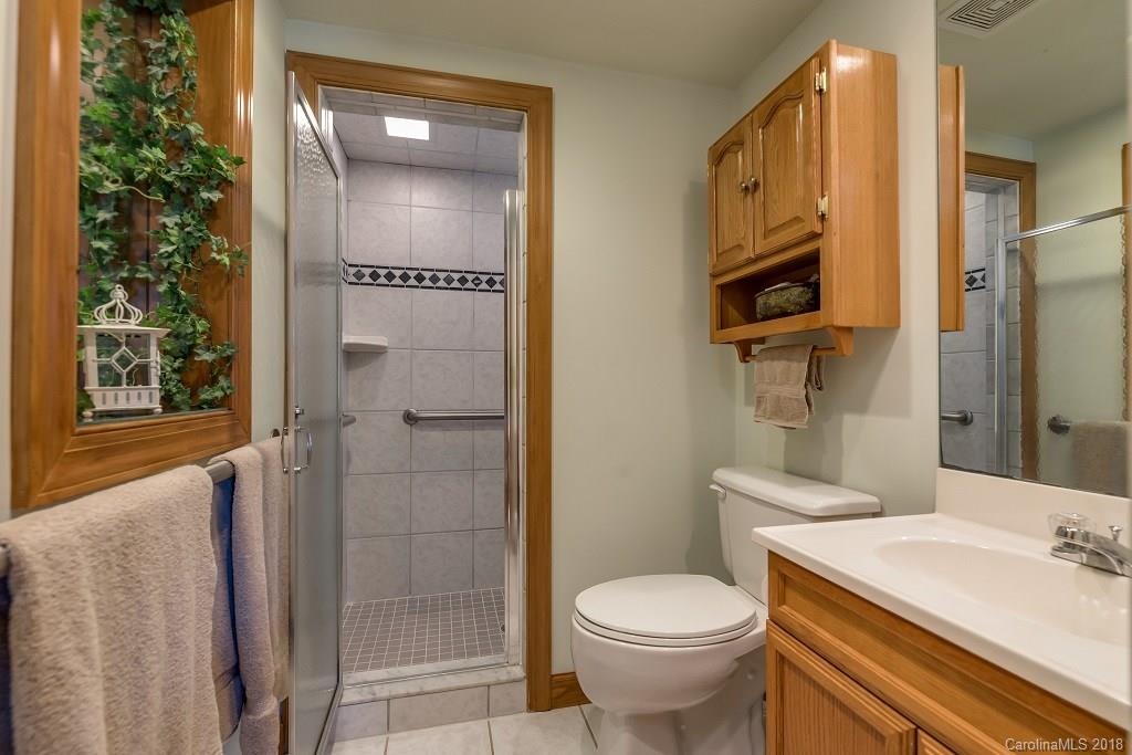2141 Coxe Road, Unit 96 Rutherfordton, NC 28139 - Photo 12 of 25 a bathroom with a sink a toilet and shower