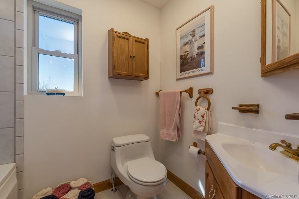 2141 Coxe Road, Unit 96 Rutherfordton, NC 28139 - Photo 18 of 25 a white toilet sitting next to a bathroom sink