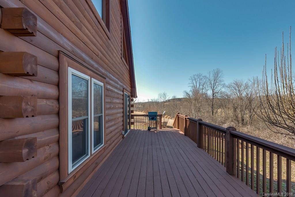 2141 Coxe Road, Unit 96 Rutherfordton, NC 28139 - Photo 19 of 25 a view of a balcony with wooden floor and fence