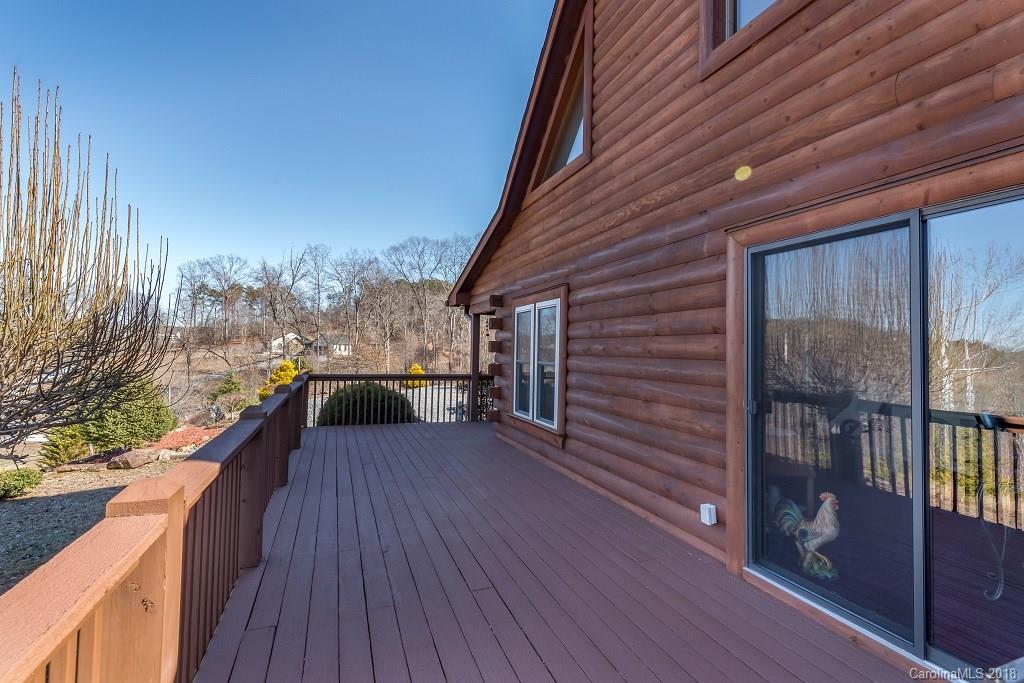 2141 Coxe Road, Unit 96 Rutherfordton, NC 28139 - Photo 20 of 25 a view of a balcony with wooden floor and iron stairs