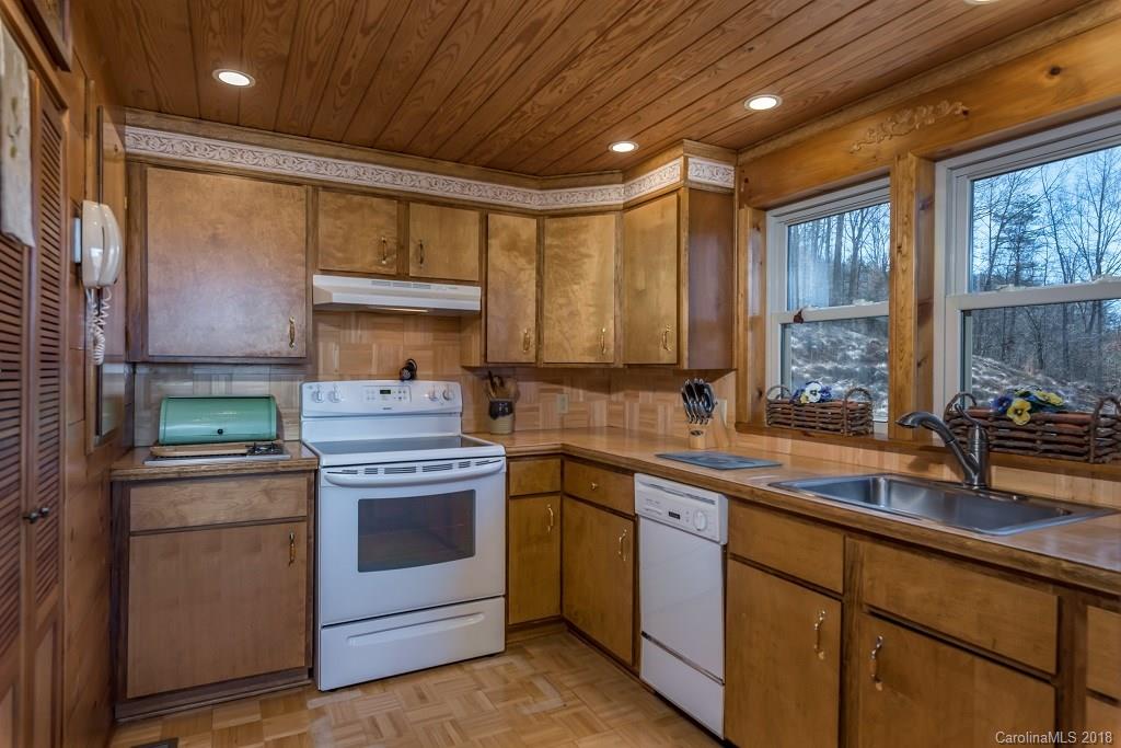 2141 Coxe Road, Unit 96 Rutherfordton, NC 28139 - Photo 6 of 25 a kitchen with a sink stove and cabinets